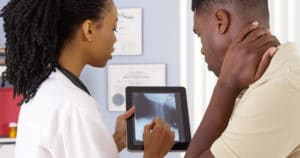 doctor showing patient x-ray