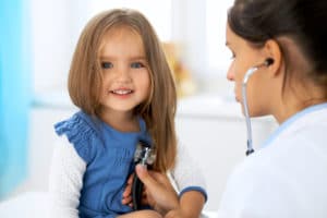 child getting heart rate check by doctor